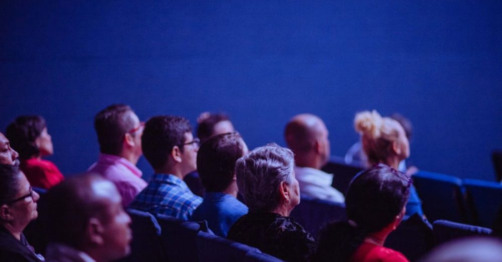 Event - People Sitting on Gang Chairs