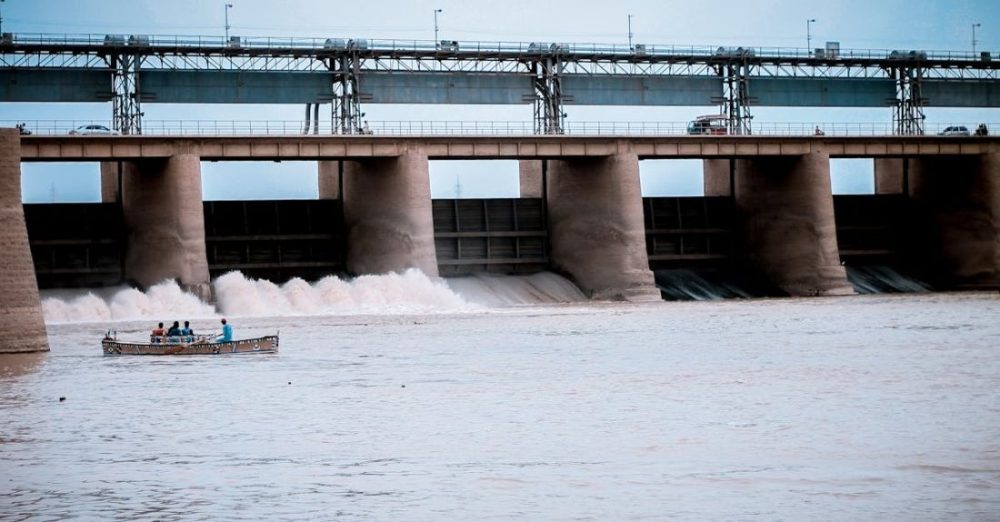 Hydroelectric - People in Boat Near Water Dam